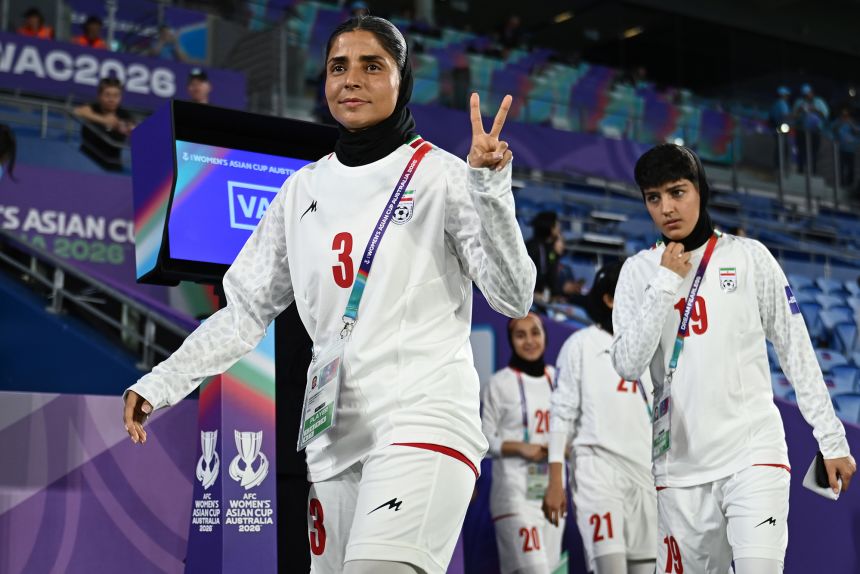 Iran defender Atefeh Ramezanizadeh walks out for the start of a match against South Korea on Monday.