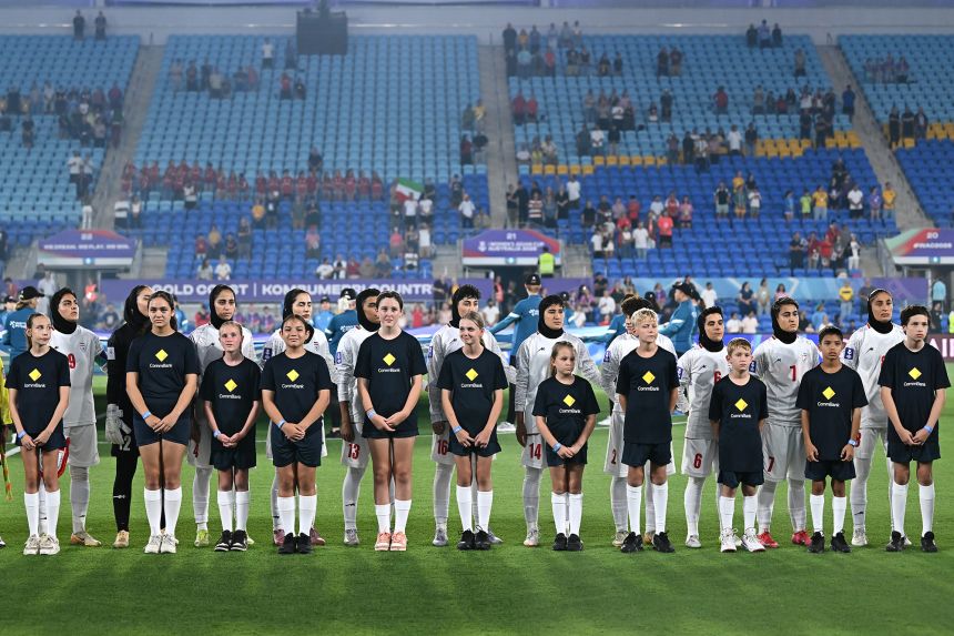 Iran's players decline to sing their country's anthem ahead of their opening match of the Women's Asian Cup against South Korea.