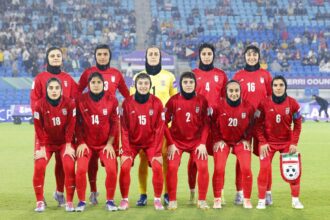 Iran's team pose for a group photo before the AFC Women's Asian Cup match against the Philippines on the Gold Coast, March 8, 2026.