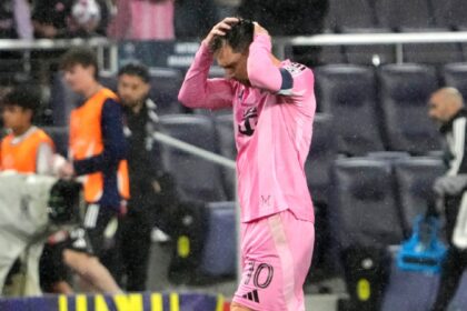Inter Miami forward Lionel Messi leaves the field in the rain after a draw against Nashville SC in a CONCACAF Champions Cup Round of 16 soccer match, Wednesday, March 11, 2026, in Nashville. (AP Photo)