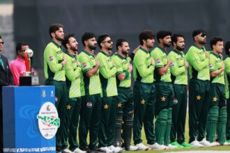 Pakistan's players stand up for the national anthem before the start of the first one day international cricket match between Bangladesh and Pakistan in Mirpur, Bangladesh, Wednesday, March 11, 2026. (AP Photo/Mahmud Hossain Opu)
