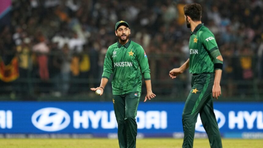 Pakistan's captain Salman Ali Agha, left, has a word with teammate Shaheen Shah Afridi during the T20 World Cup cricket match between Pakistan and Sri Lanka in Pallekele, Sri Lanka, Saturday, Feb. 28, 2026. (AP Photo)