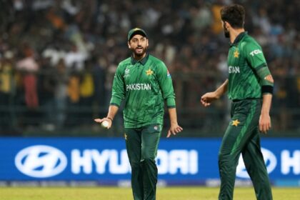 Pakistan's captain Salman Ali Agha, left, has a word with teammate Shaheen Shah Afridi during the T20 World Cup cricket match between Pakistan and Sri Lanka in Pallekele, Sri Lanka, Saturday, Feb. 28, 2026. (AP Photo)