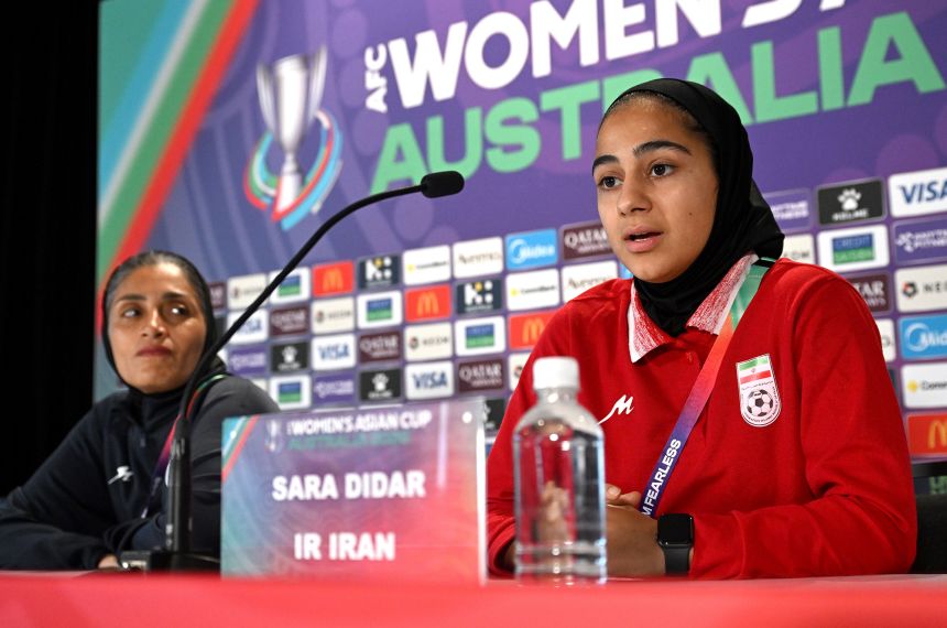 Iran head coach Marziyeh Jafari looks at Lionesses forward Sara Didar at a press conference on Wednesday.