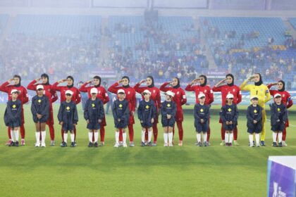 The Iranian players salute the national anthem before the Women's Asian Cup match with the Philippines at Gold Coast Stadium on March 08 2026.