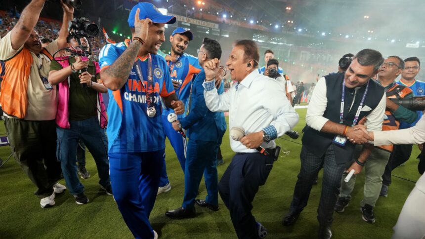 India's captain Suryakumar Yadav dances with former India international Sunil Gavaskar after India won the T20 World Cup final match against New Zealand in Ahmedabad. (PHOTO: AP)