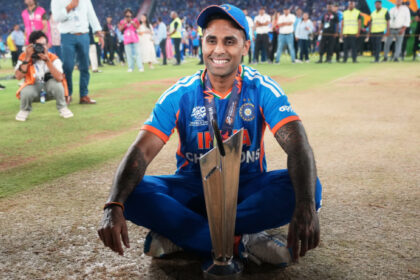 India's captain Suryakumar Yadav poses with the trophy after India won the T20 World Cup final match against New Zealand in Ahmedabad, India, Sunday, March 8, 2026. (AP Photo)