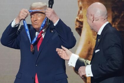 President Donald Trump is presented with the inaugural FIFA Peace Prize by FIFA President Gianni Infantino during the 2026 FIFA World Cup draw at the Kennedy Center, Dec. 5, 2025, in Washington. (AP Photo)