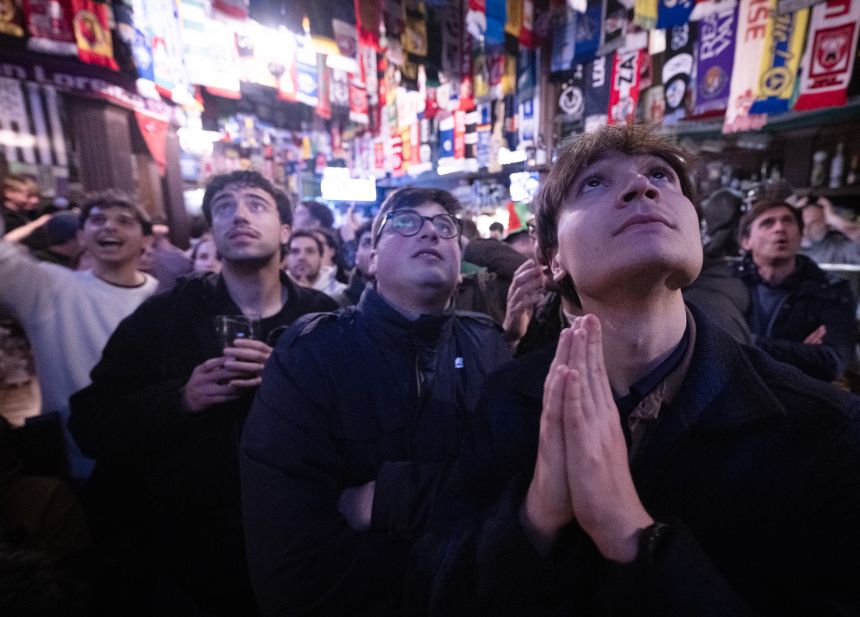 Italy supporters react as they watch in a bar in central Rome on March 31. Italy lost in a penalty shoot-out and failed to qualify for a third straight World Cup.