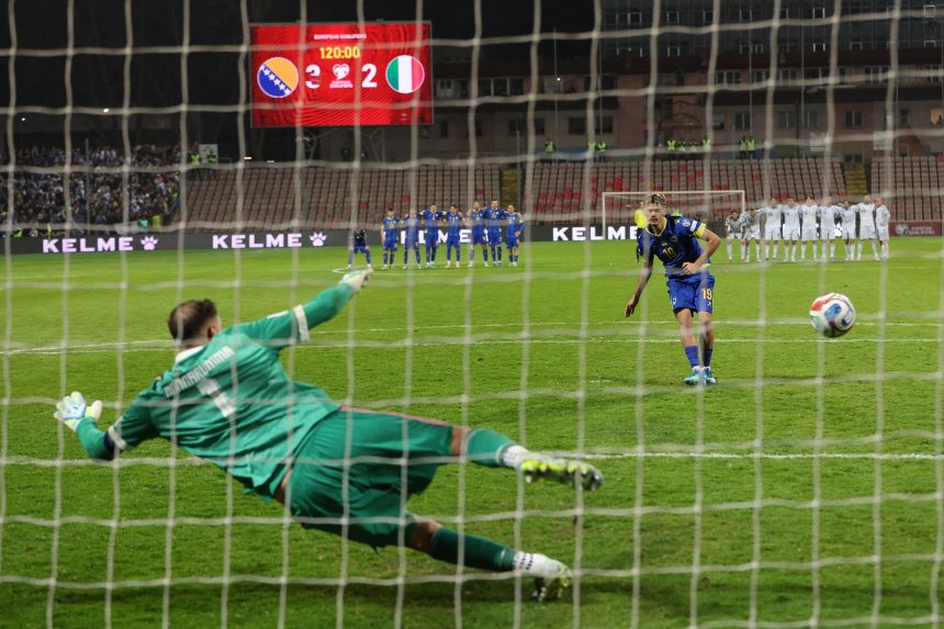 Bosnia and Herzegovina's Kerim-Sam Alajbegovic scores a penalty past Gianluigi Donnarumma.