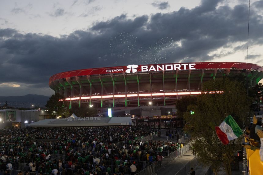 Fans line up outside Azteca Stadium, officially renamed Estadio Banorte, on the day of a friendly match between the national teams of Mexico and Portugal held to mark the stadium's inauguration on March 28.