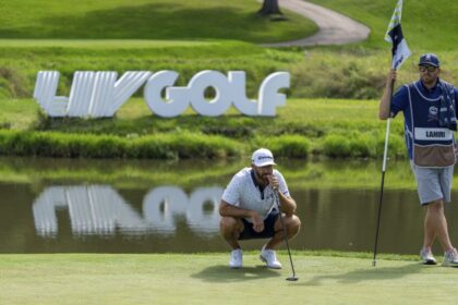 Dustin Johnson reads a green during a LIV Golf event in Illinois in 2023.