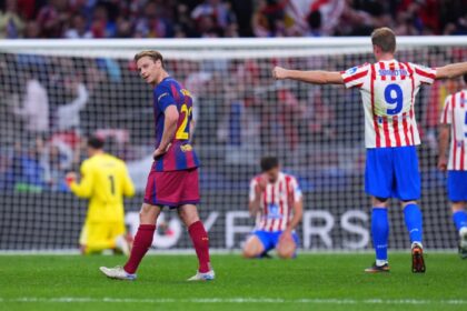 Barcelona's Frenkie de Jong, center, reacts at the end of the Champions League quarterfinal second leg soccer match between Atletico Madrid and Barcelona in Madrid. (AP Photo)