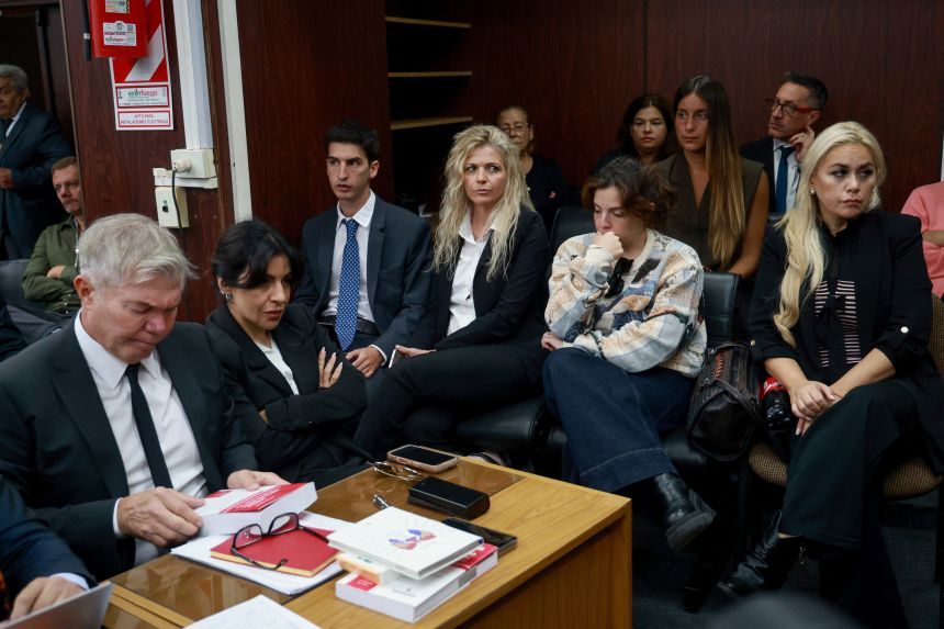 Dalma Maradona (2-R) and Gianinna Maradona (2-L), daughters of Argentine football legend Diego Maradona and his former partner, Veronica Ojeda (R), are seen at a courthouse during a preliminary hearing in a trial over his death in San Isidro on Tuesday.