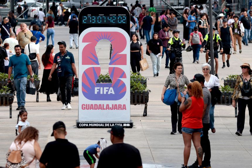 People walk past the World Cup 2026 countdown clock at Paseo Alcalde in Guadalajara, Mexico on September 10, 2025.