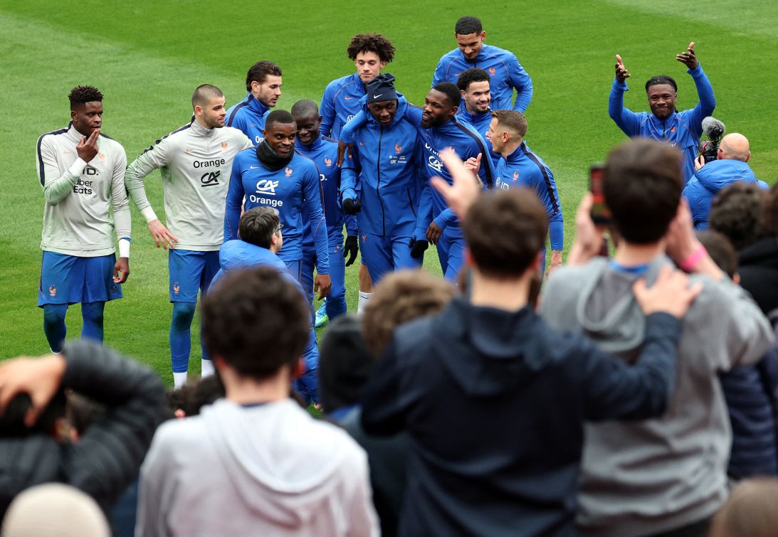 France national team players are greeted by fans during a training session at Northwest Stadium in Landover, Maryland, on March 27, 2026.