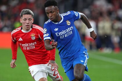 The new rule on players receiving red cards for covering their mouths comes after Benfica's Gianluca Prestianni was accused of homophobic abuse of Real Madrid's Vinicius Junior during a Champions League game by covering his mouth with his jersey. (PHOTO: AP)