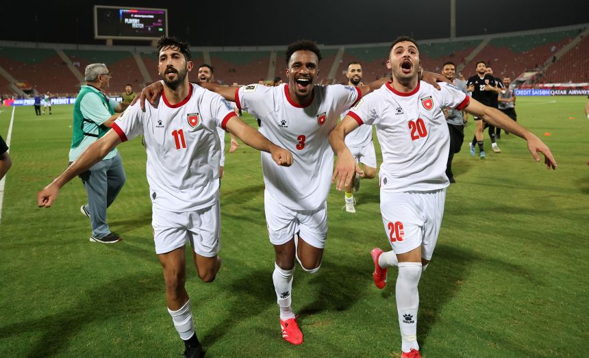 Left to right: Jordan's Yazan Al-Naimat, Abdallah Nasib and Mohannad Abu Taha celebrate after defeating Oman in a World Cup qualifying match in Muscat, Oman, on June 5.