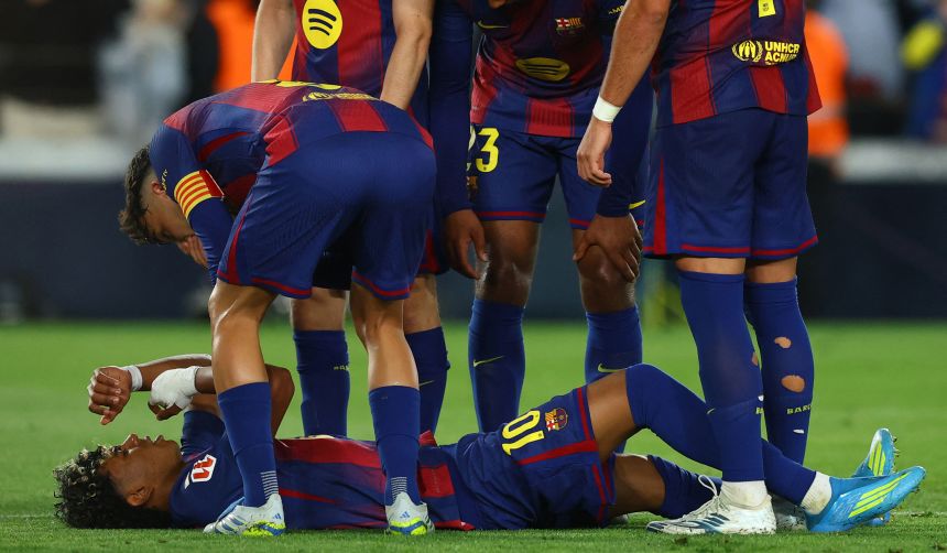 FC Barcelona's Lamine Yamal lies on the ground after sustaining an injury during a LaLiga match on April 22.