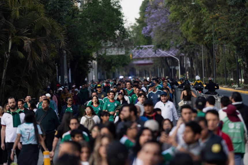 Fans walk near the Estadio Banorte before a friendly match between Mexico and Portugal in March.