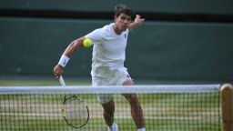 Carlos Alcaraz of Spain returns against Italy's Jannik Sinner in the men's singles final at the Wimbledon Tennis Championships in London, Sunday, July 13, 2025. (AP Photo/Kin Cheung)