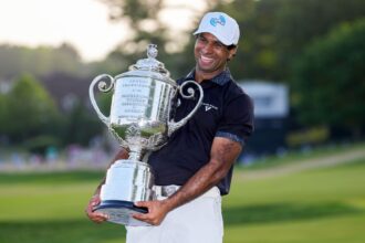 Aaron Rai holds the Wanamaker Trophy after winning the PGA Championship on Sunday, his first major title.