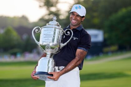 Aaron Rai holds the Wanamaker Trophy after winning the PGA Championship on Sunday, his first major title.