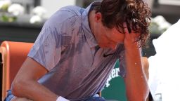 Jannik Sinner of Italy reacts as he cools himself with the water during a break at the second round men's singles tennis match against Juan Manuel Cerundolo of Argentina at the French Open tennis tournament in Paris, Thursday, May 28, 2026, as temperature rises up to 33 C (91 F).