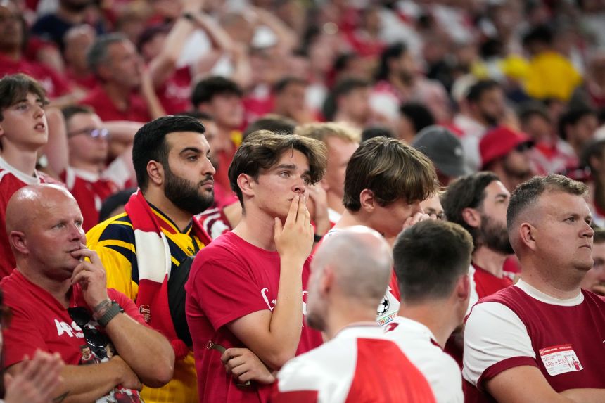 Arsenal fans react at the end of the Champions League final match in Budapest.