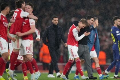 Arsenal's manager Mikel Arteta embraces Martin Odegaard and Leandro Trossard, right, at the the end of a Champions League semifinal, second leg, soccer match between Arsenal FC and Atletico Madrid at Emirates Stadium in London. (AP Photo)