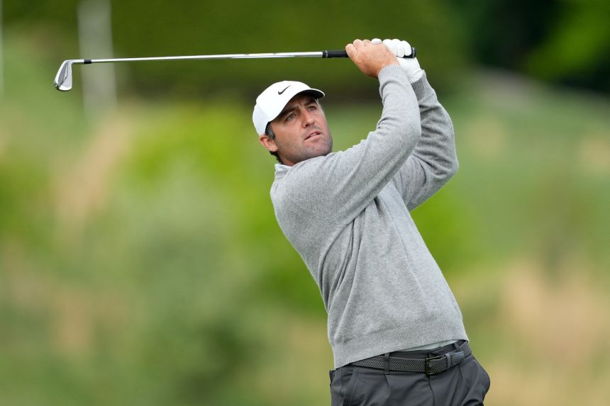 Scottie Scheffler plays his shot on the tenth hole during the first round of the PGA Championship golf tournament at Aronimink Golf Club on Thursday, in Newtown Square, Pennsylvania.