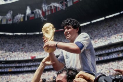 Argentinian soccer legend Diego Armando Maradona holding the World Cup trophy after the Albiceleste defeated West Germany 3-2 in the 1986 FIFA World Cup Final at the Azteca Stadium in Mexico City, Mexico on June 29, 1986.