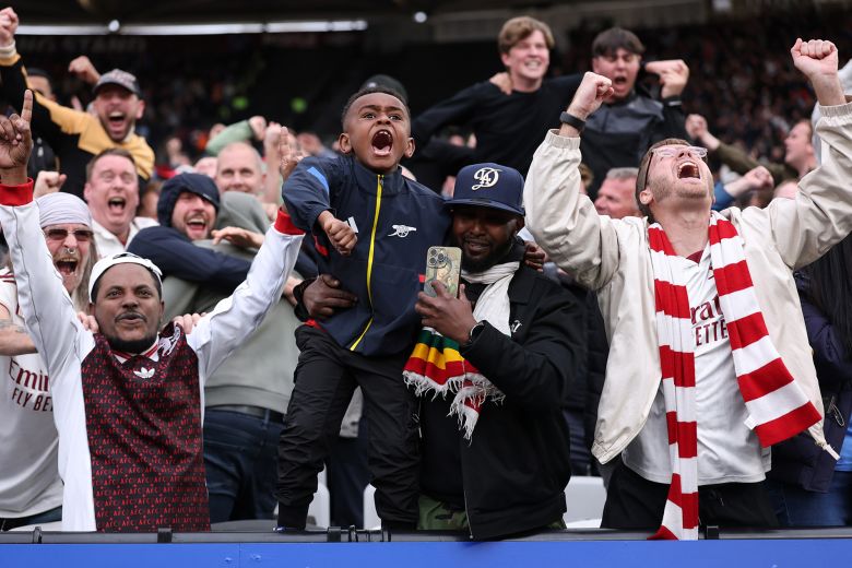 Arsenal fans celebrate during the match between West Ham United and Arsenal.