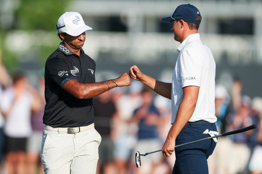 Aaron Rai of England is congratulated by Ludvig Aberg of Sweden after a putt on the 17th green during the final round of the PGA Championship.