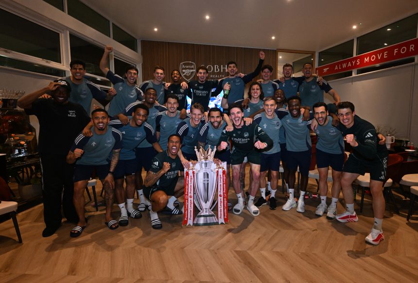 The Arsenal squad celebrates winning the Premier League at Sobha Realty Training Centre in London Colney, England.
