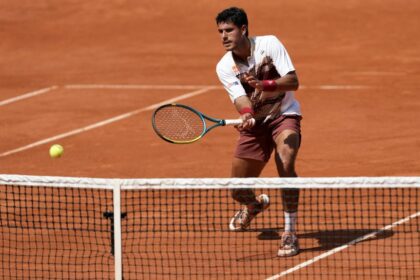 Adolfo Daniel Vallejo hits a volley during his second-round match against Moise Kouame on Thursday.