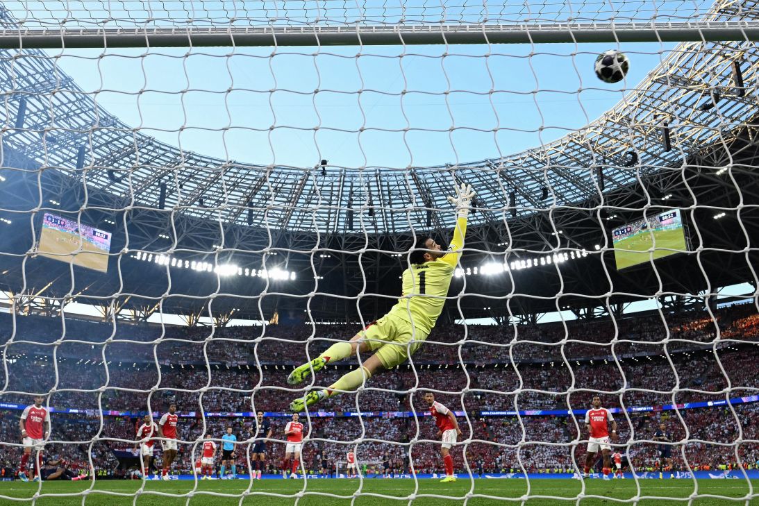 Arsenal's goalkeeper David Raya dives for the ball during the final.
