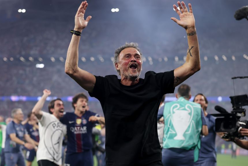 Luis Enrique celebrates after winning his third Champions League title.