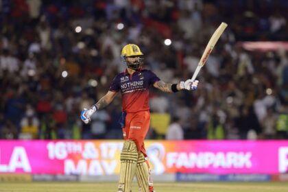 Virat Kohli of Royal Challengers Bengaluru raises his bat after scoring a fifty during Match 57. (Photo by Sumeet Parmar / CREIMAS for IPL)