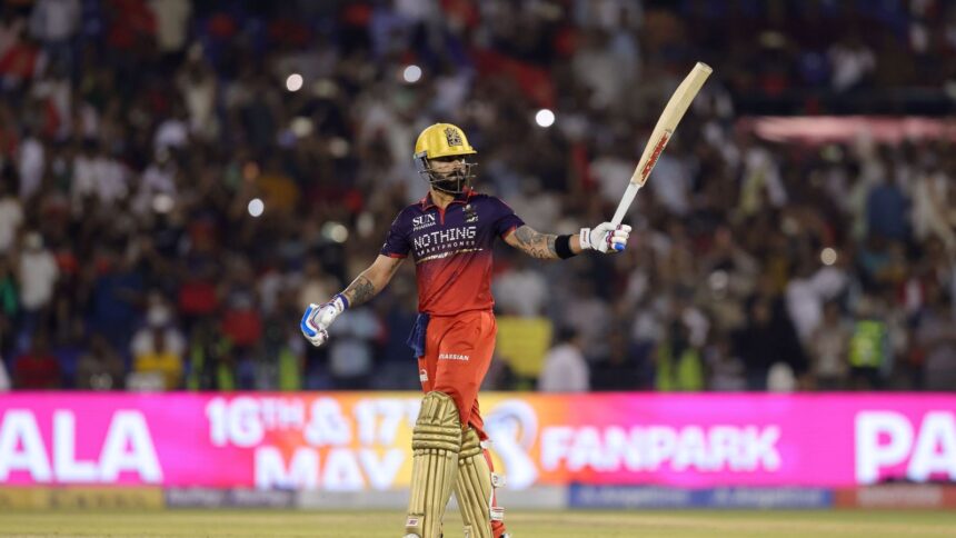Virat Kohli of Royal Challengers Bengaluru raises his bat after scoring a fifty during Match 57. (Photo by Sumeet Parmar / CREIMAS for IPL)