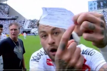 Neymar snatched the official substitution request sheet from the fourth official and held it up in front of the TV cameras to tell broadcasters that Santos coach Cuca had written teammate Escobar's number on it rather than Neymar's. (Screengrab via X)