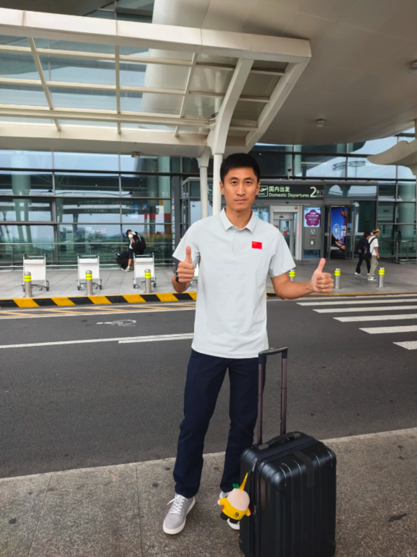 FIFA referee Ma Ning poses at an airport before heading off to the Americas for the 2026 World Cup in a post on his social media page.