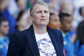 United States head coach Emma Hayes looks on during the national anthem before the women's soccer gold medal match at the 2024 Olympics.