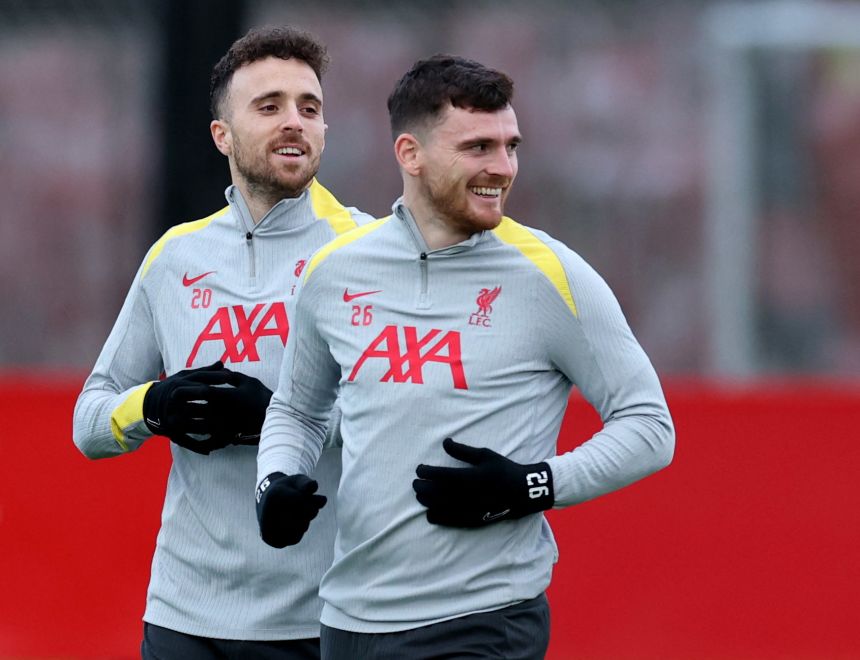 Diogo Jota, left, and Andy Robertson train before a Champions League match for Liverpool in 2024.