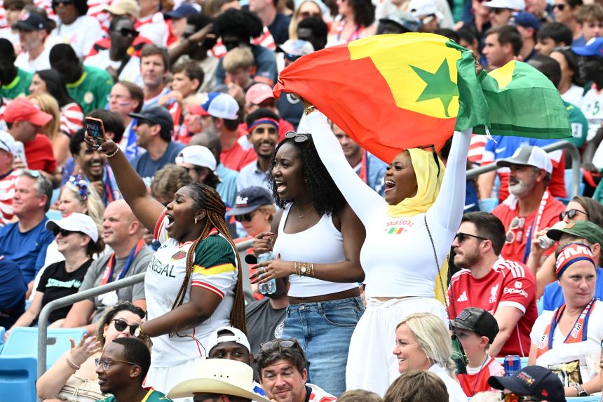 Senegal fans watch their team play in Charlotte.