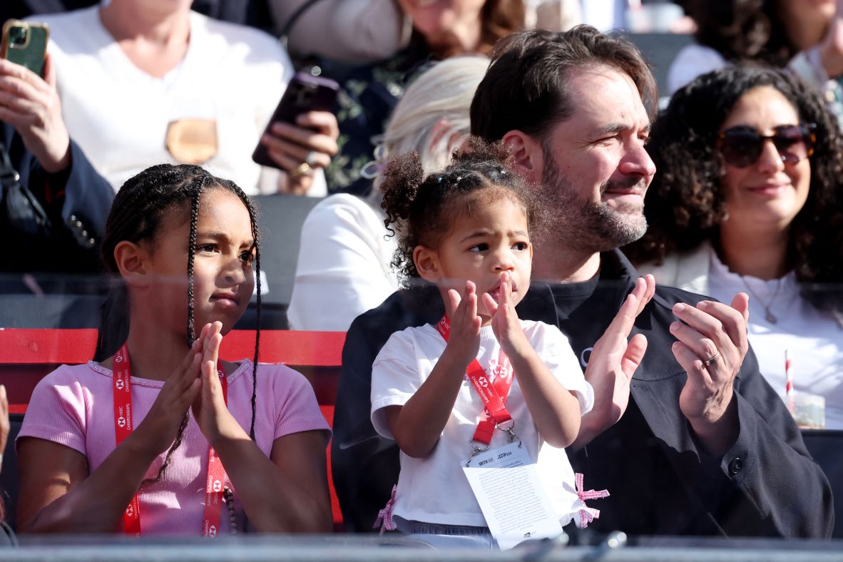 Williams' husband, Alexis Ohanian, watches his wife's return along with their children, Olympia and Adira.
