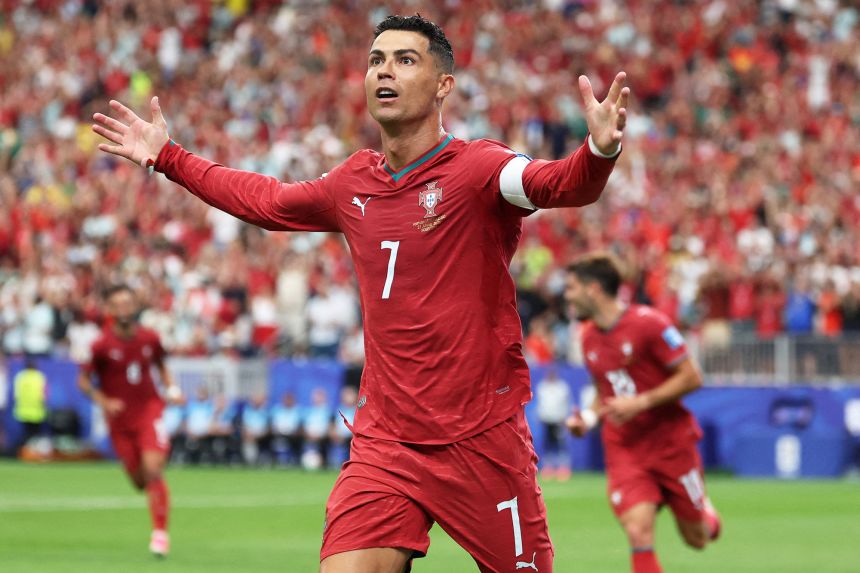 Portugal's Cristiano Ronaldo celebrates scoring their third goal.