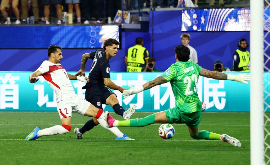 US star Christian Pulisic takes a shot on goal in the second half.