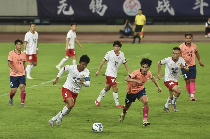 Players compete in the Jiangsu Football City League in Wuxi, China, in June 2025.