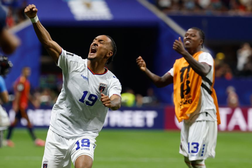 Cape Verde's Dailon Livramento, left, and Sidny Lopes Cabral celebrate after the team drew Spain in a World Cup Group H soccer match in Atlanta.